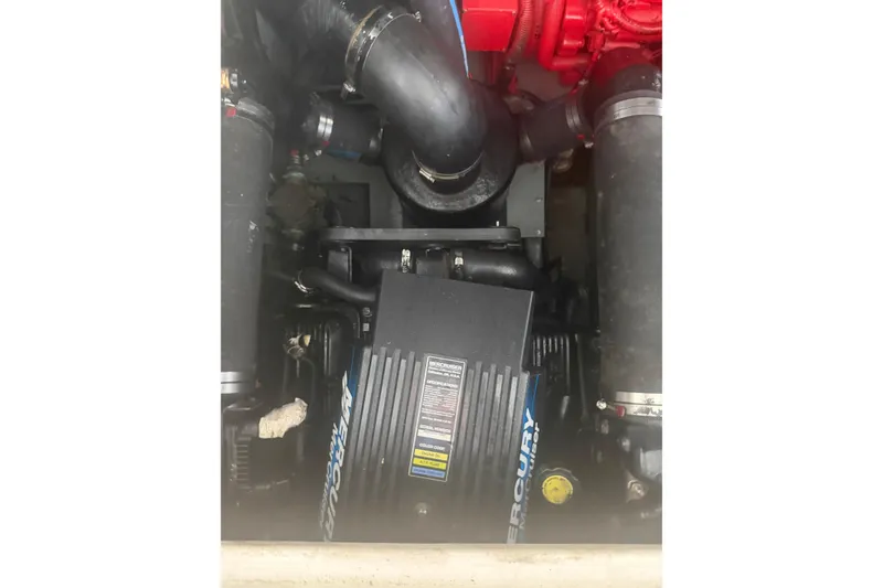 Slide: The Image of Engine compartment of a 2000 Sea Ray Sundancer 310 boat, featuring Mercury components. - 20