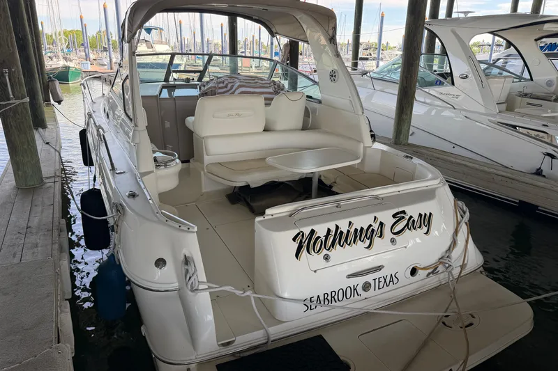 Slide: The Image of Sea Ray Sundancer 310 boat docked, rear view, named "Nothing's Easy," Seabrook, Texas, 2000 model. - 5