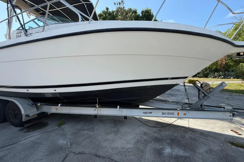 Slide: The Image of Century 3200 Walk-Around 2000 model boat on trailer, side view. - 12