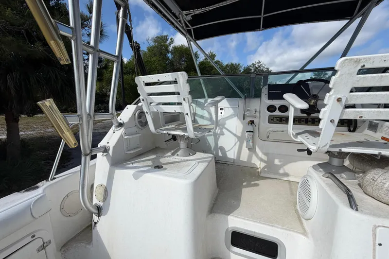 Slide: The Image of Century 3200 Walk-Around 2000 model boat interior with helm and seating area. - 39