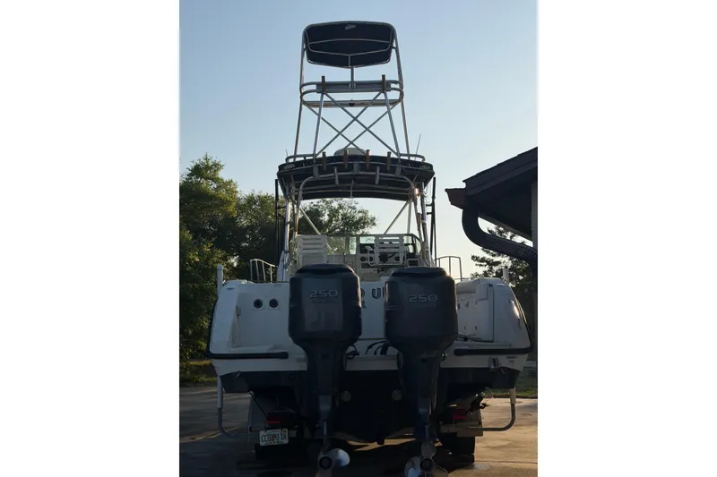 Slide: The Image of 2000 Century 3200 Walk-Around boat with dual 250 engines, rear view. - 4