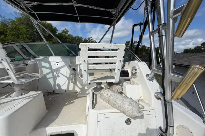 Slide: The Image of Century 3200 Walk-Around 2000 model boat interior with seating and canopy. - 40