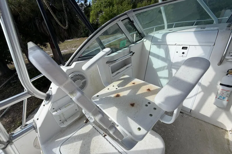 Slide: The Image of Century 3200 Walk-Around 2000 model boat interior with seating and control panel. - 46