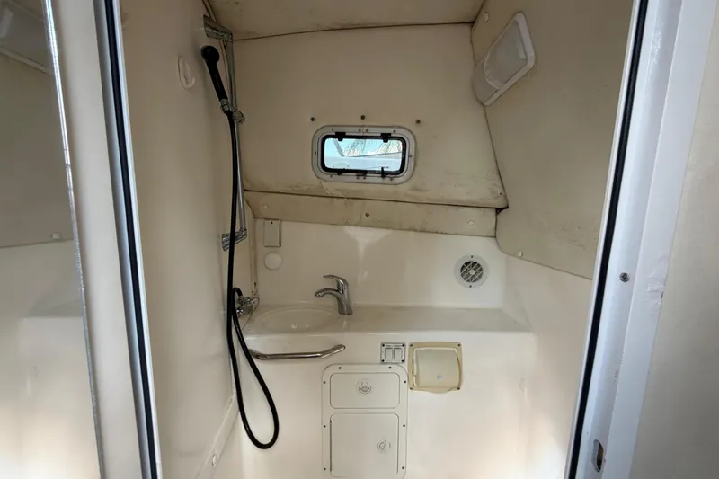 Slide: The Image of Interior of a 2000 Century 3200 Walk-Around boat bathroom with shower and sink. - 62