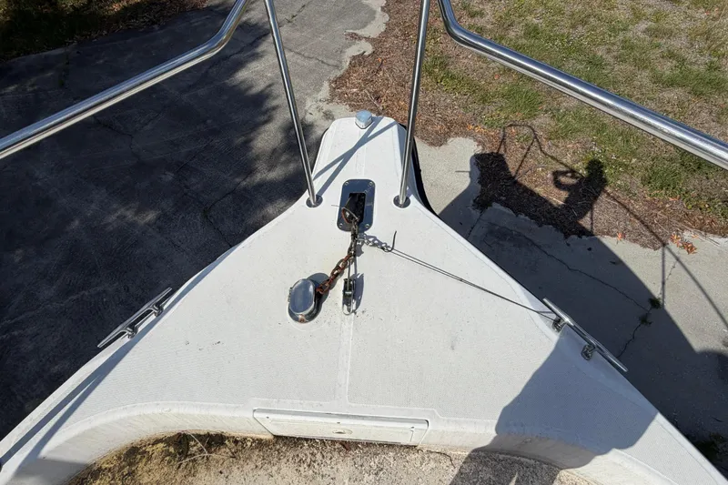 Slide: The Image of Bow of a 2000 Century 3200 Walk-Around boat with anchor chain and railing. - 73