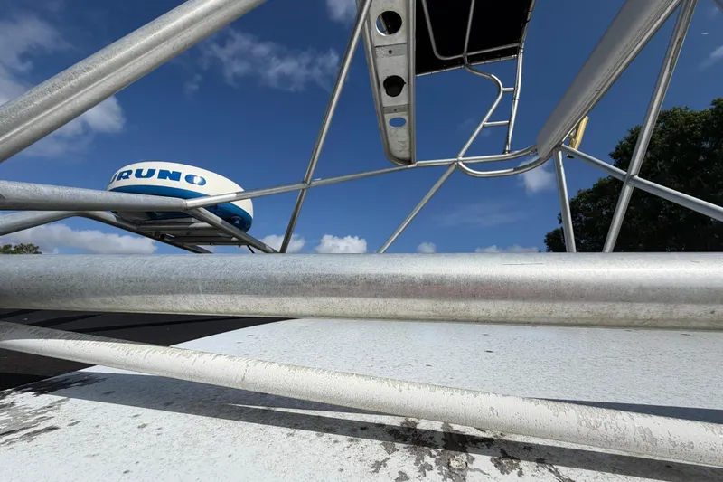 Slide: The Image of Century 3200 Walk-Around 2000 boat radar and tower against blue sky. - 78