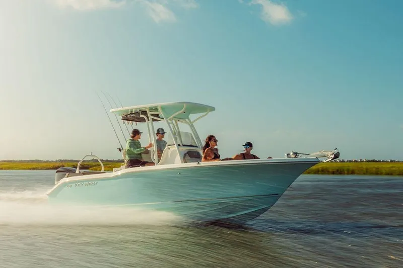 Slide: The Image of 2026 Key West 239 FS boat cruising on a sunny day with passengers onboard. - 11