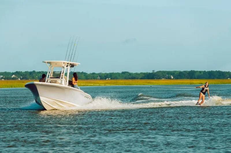 Slide: The Image of 2026 Key West 239 FS boat towing a wakeboarder on a sunny day. - 12
