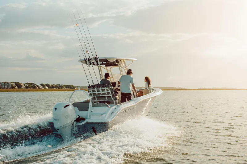 Slide: The Image of 2026 Key West 239 FS boat cruising on open water at sunset. - 7