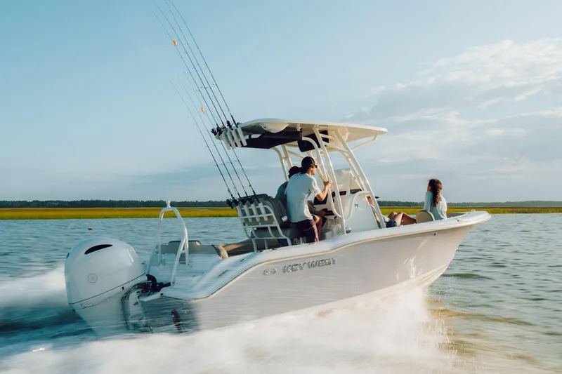 Slide: The Image of 2026 Key West 239 FS boat cruising on a sunny day with passengers enjoying the ride. - 9