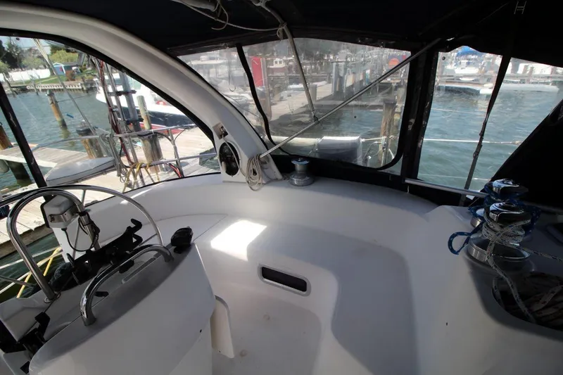 Slide: The Image of Cockpit of a 1999 Hunter 410 sailboat with steering wheel and winches. - 11