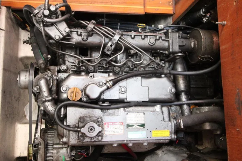 Slide: The Image of 1999 Hunter 410 engine, detailed view of mechanical components and wiring. - 26