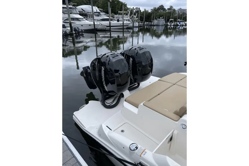 Slide: The Image of 2018 Sea Ray SDX 290 Outboard with dual Mercury engines docked at marina. - 10