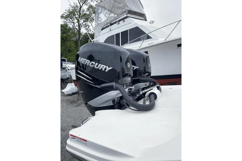 Slide: The Image of 2018 Sea Ray SDX 290 Outboard with twin Mercury engines docked. - 12