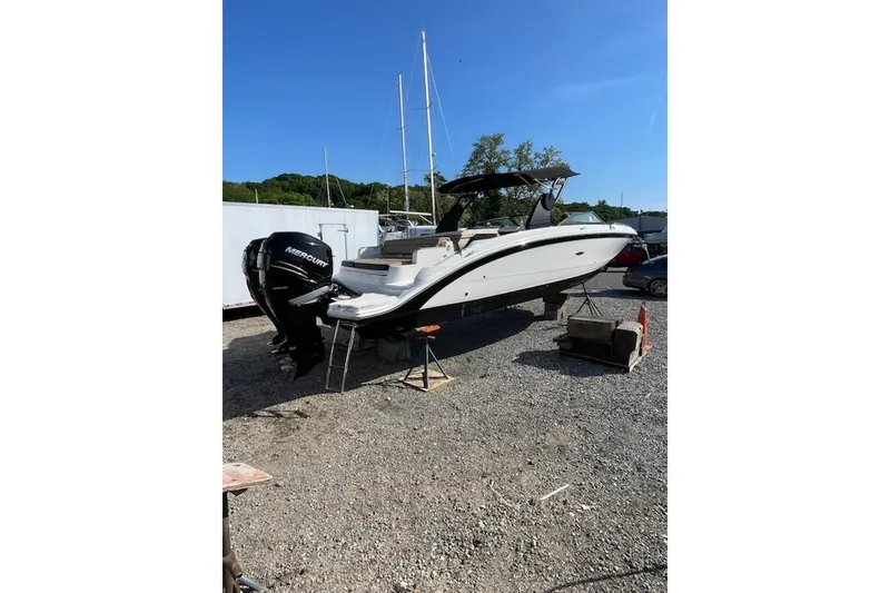 Slide: The Image of 2018 Sea Ray SDX 290 Outboard boat on gravel lot with Mercury engines. - 16