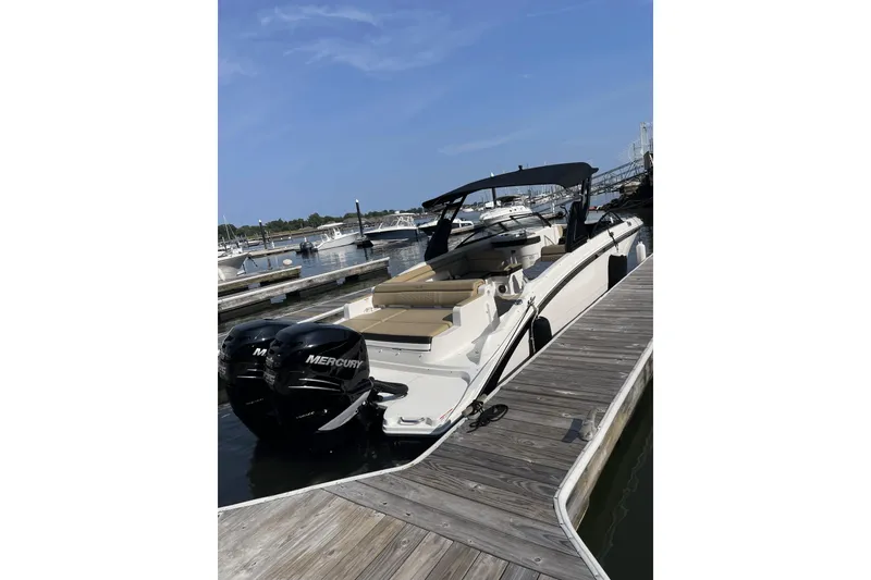 Slide: The Image of 2018 Sea Ray SDX 290 Outboard docked at marina with twin Mercury engines. - 5
