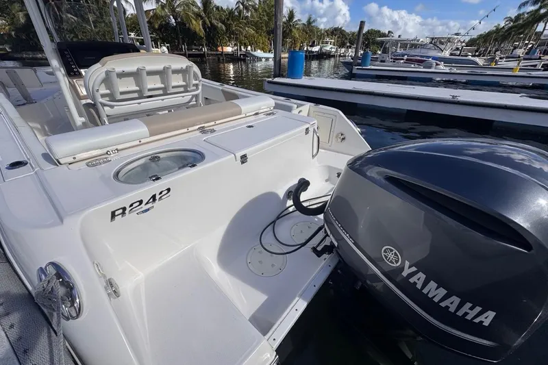 Slide: The Image of 2020 Robalo R242 Explorer boat with Yamaha engine docked at marina. - 11