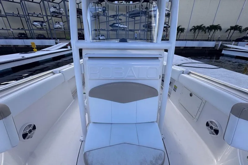 Slide: The Image of 2020 Robalo R242 Explorer boat interior with seating and storage compartments. - 37