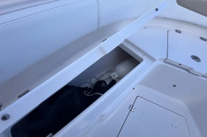 Slide: The Image of Storage compartment on a 2020 Robalo R242 Explorer boat, showcasing interior space. - 39