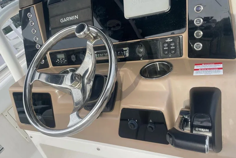 Slide: The Image of 2020 Robalo R242 Explorer helm with Garmin display and Yamaha controls. - 4
