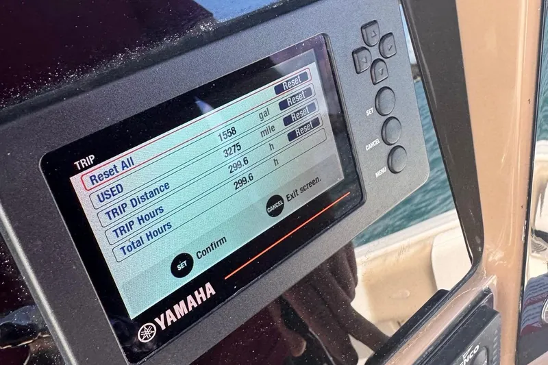 Slide: The Image of Yamaha display on 2020 Robalo R242 Explorer showing trip data and settings. - 48