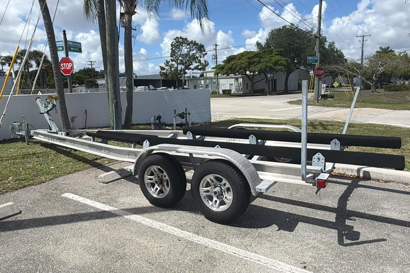 Slide: The Image of Trailer for 2020 Robalo R242 Explorer boat parked on sunny street. - 49