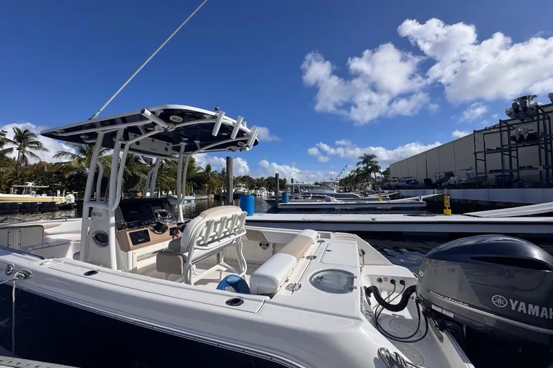 Slide: The Image of 2020 Robalo R242 Explorer boat docked under a clear blue sky. - 7