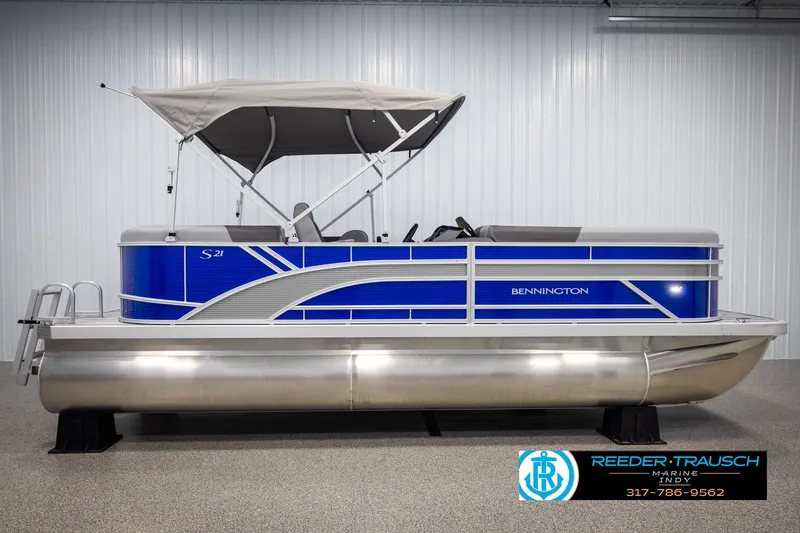Slide: The Image of 2025 Bennington 21 SSR pontoon boat with blue design and canopy. - 5