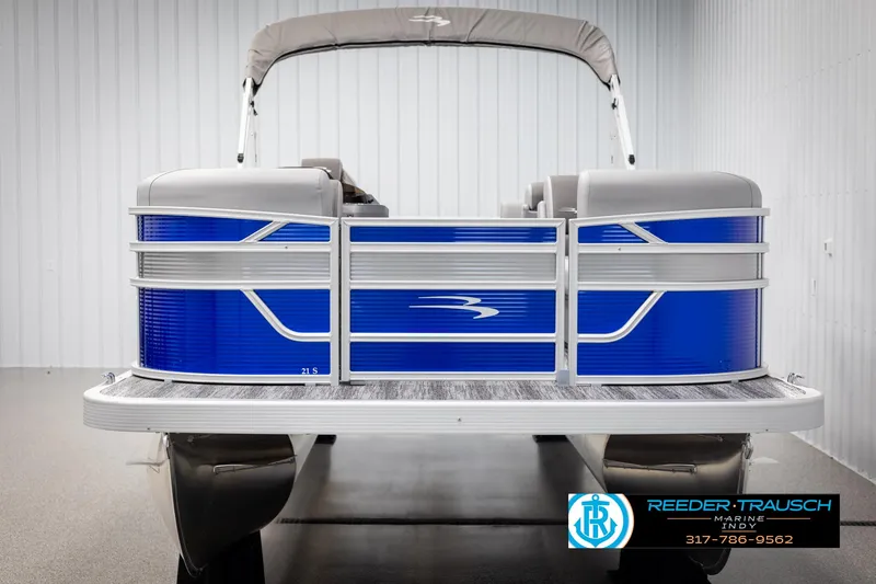Slide: The Image of 2025 Bennington 21 SSR pontoon boat in showroom setting. - 8
