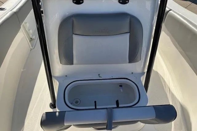 Slide: The Image of 2022 NauticStar 2102 Legacy boat interior with seating and storage compartment. - 10