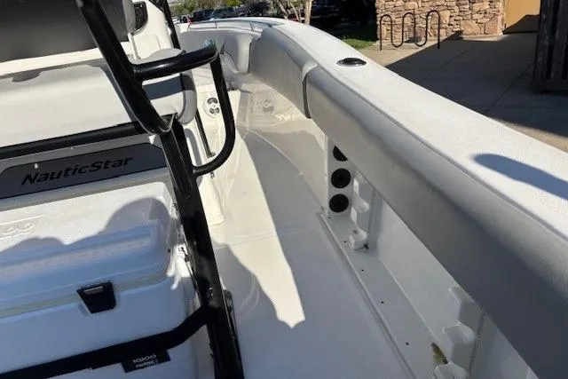Slide: The Image of 2022 NauticStar 2102 Legacy boat interior, featuring sleek white seating and modern design elements. - 15