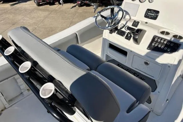 Slide: The Image of 2022 NauticStar 2102 Legacy boat interior with steering console and seating. - 3