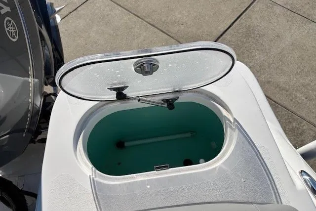 Slide: The Image of Open livewell on 2022 NauticStar 2102 Legacy boat, showcasing interior design. - 7