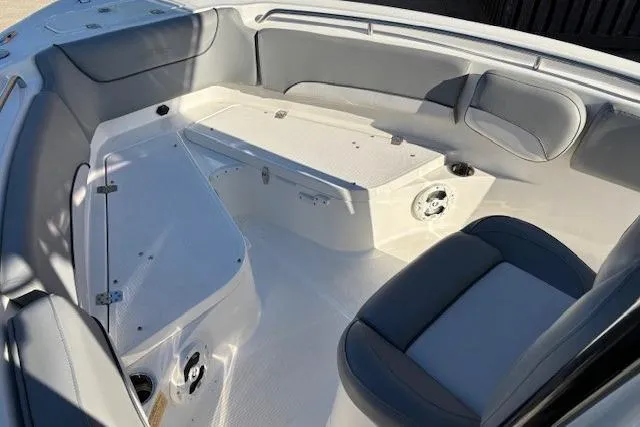 Slide: The Image of 2022 NauticStar 2102 Legacy boat interior with gray seating and storage compartments. - 8