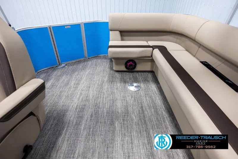 Slide: The Image of Interior of a 2025 Bennington 20 SL pontoon boat with beige seating. - 15