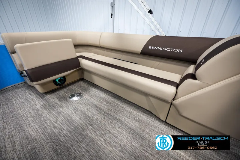 Slide: The Image of Interior of 2025 Bennington 20 SL with beige upholstery. - 22