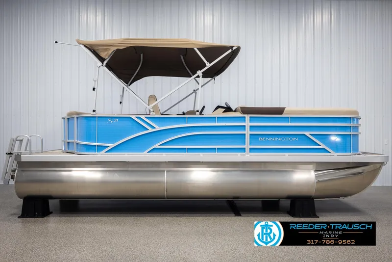 Slide: The Image of Bennington 20 SL 2025 pontoon boat with blue design and canopy. - 5