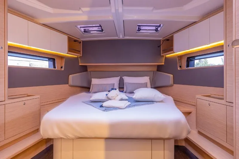 Slide: The Image of Luxurious cabin interior of 2026 Dufour 48 yacht with modern design and cozy bedding. - 39