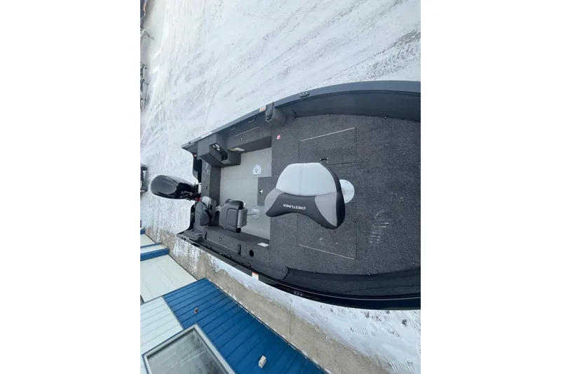 Slide: The Image of 2026 Crestliner 1650 Pro Tiller boat on snowy ground, showcasing interior seating and layout. - 14