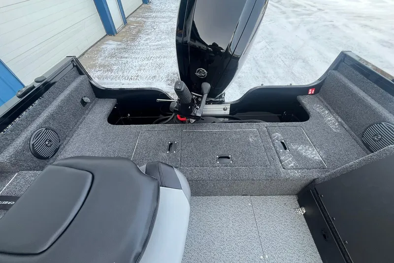 Slide: The Image of 2026 Crestliner 1650 Pro Tiller boat interior with motor and seating. - 18