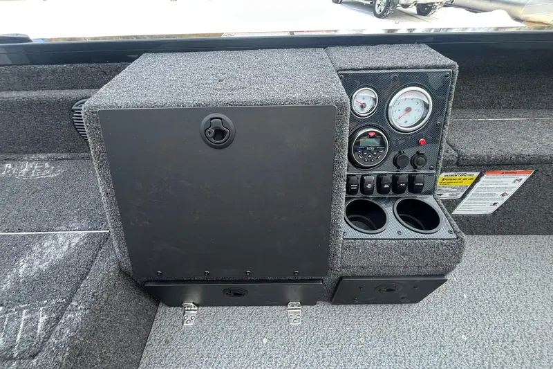 Slide: The Image of Control panel of 2026 Crestliner 1650 Pro Tiller boat with gauges and cup holders. - 19