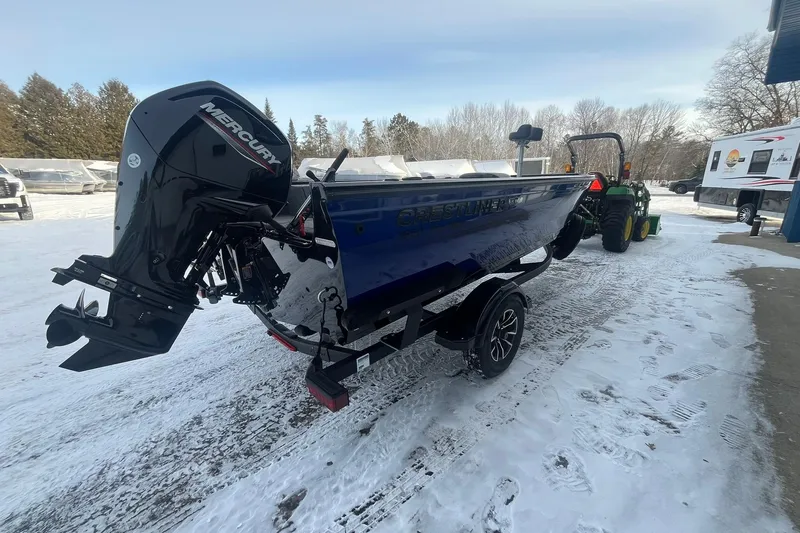 Slide: The Image of 2026 Crestliner 1650 Pro Tiller boat with Mercury engine on snowy ground. - 4