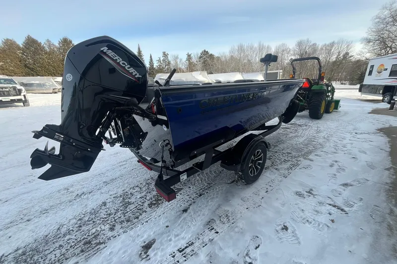 Slide: The Image of 2026 Crestliner 1650 Pro Tiller boat with Mercury engine on snowy ground. - 5