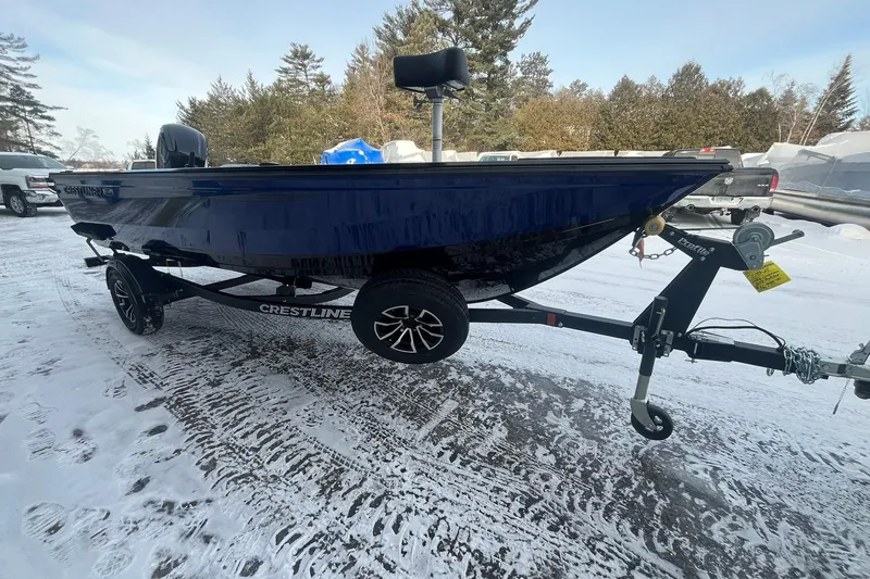 Slide: The Image of 2026 Crestliner 1650 Pro Tiller boat on trailer in snowy outdoor setting. - 6