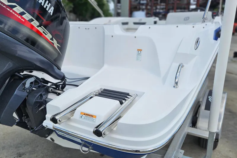 Slide: The Image of 2023 Hurricane SunDeck Sport 188 OB boat with Yamaha outboard motor and swim ladder. - 2