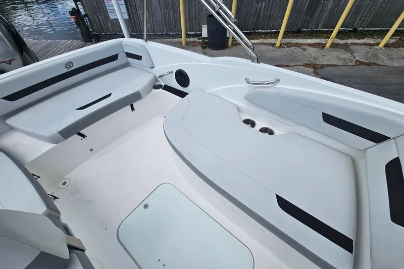 Slide: The Image of 2023 Hurricane SunDeck Sport 188 OB boat interior with spacious seating and cup holders. - 18