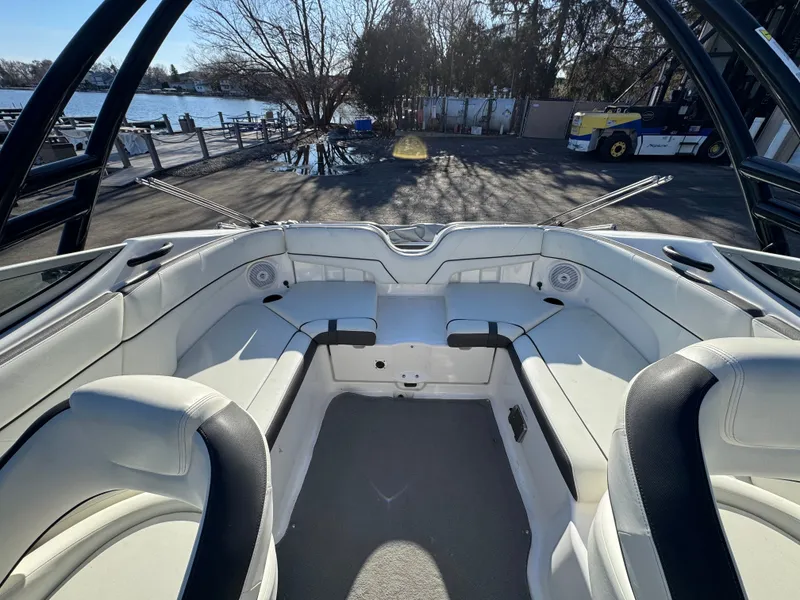 Slide: The Image of Interior of a 2014 Yamaha SX210 boat by the water. - 10