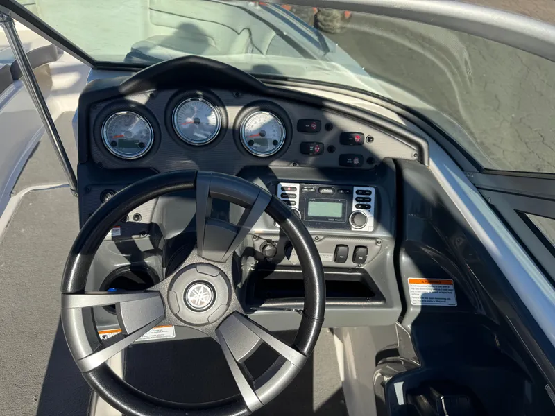 Slide: The Image of Yamaha SX210 2014 boat console with steering wheel and gauges. - 14