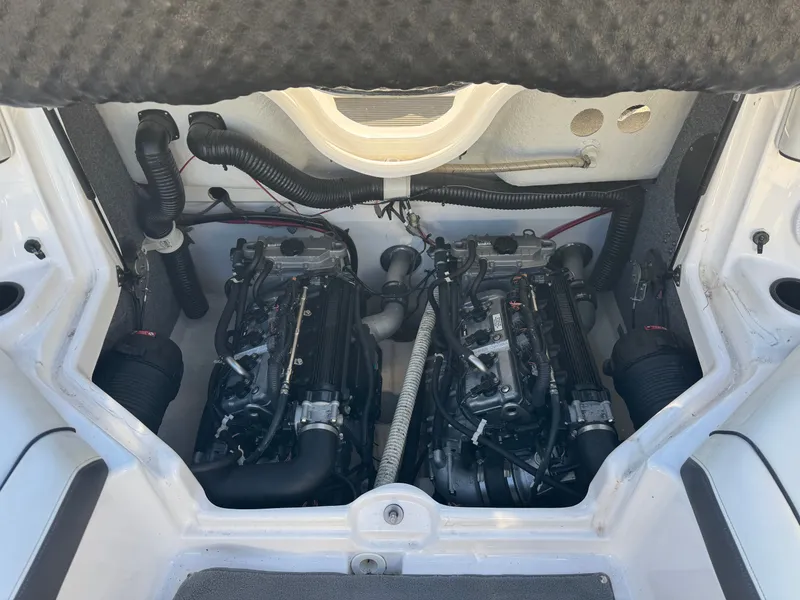 Slide: The Image of Engine compartment of a 2014 Yamaha SX210 boat with twin engines. - 17