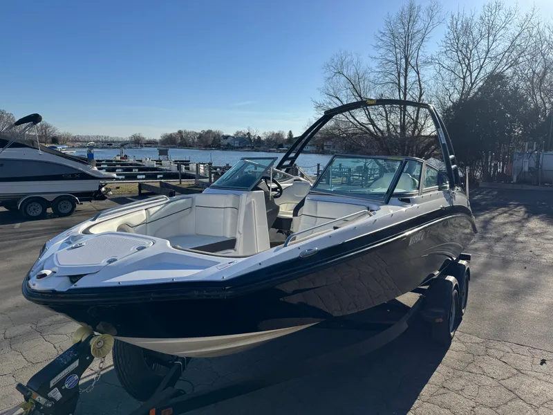 Slide: The Image of 2014 Yamaha SX210 boat by the water, sunny day. - 18